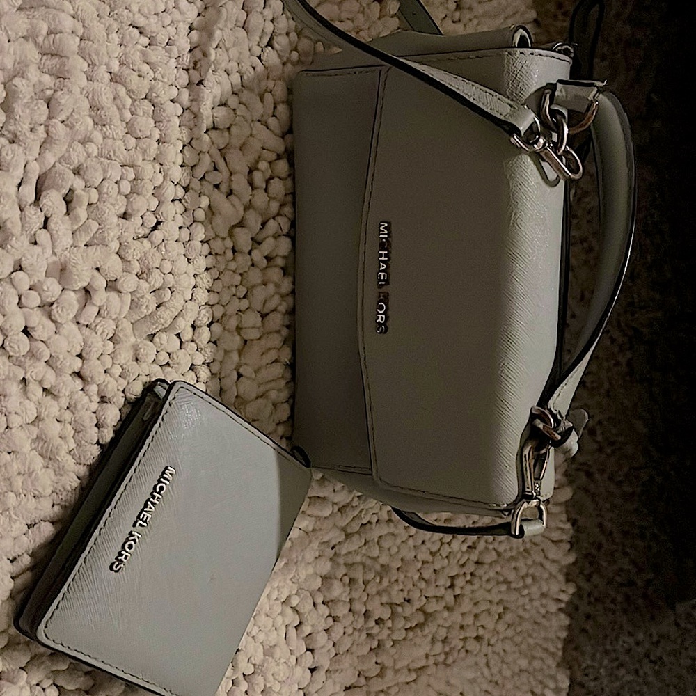 Super cute light blue MK purse and wallet . Good condition.